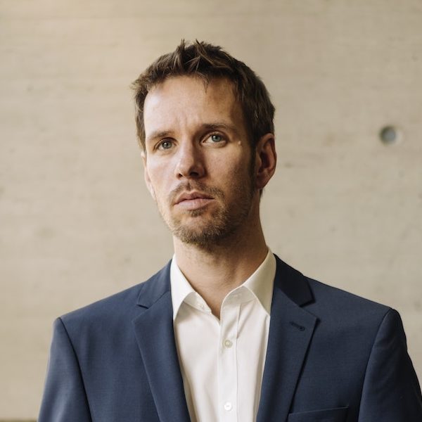 businessman-with-cup-of-coffee-in-staircase-68BGJDR